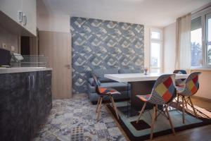 a kitchen with a table and chairs in a room at Jasmin 2 in Stara Zagora