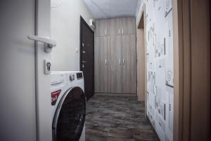 a hallway with a washing machine in a room at Jasmin 2 in Stara Zagora