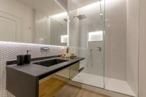a bathroom with a sink and a shower at Diva Lodging Luxury - Signoria in Florence