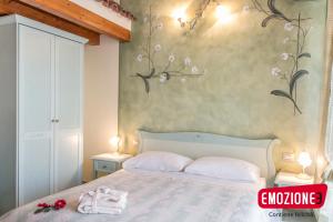 Postel nebo postele na pokoji v ubytování B&B I fiori di Marianna
