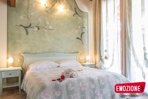 Postel nebo postele na pokoji v ubytování B&B I fiori di Marianna