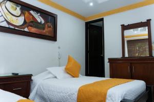 Postel nebo postele na pokoji v ubytování Hotel Aires del Quindío Armenia