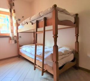 Postel nebo postele na pokoji v ubytování ALICE di SOPRA