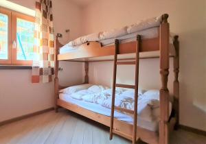 Postel nebo postele na pokoji v ubytování ALICE di SOPRA