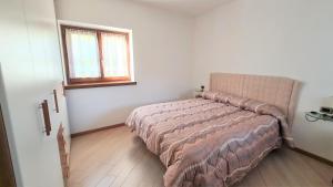 Postel nebo postele na pokoji v ubytování ALICE di SOPRA