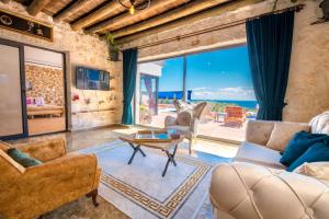 a living room with a view of the ocean at Casa Dia in Patara