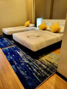 Posteľ alebo postele v izbe v ubytovaní Lovita Hotel Kuantan