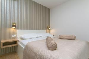 Posteľ alebo postele v izbe v ubytovaní Apartments Villa Nadalina Deluxe