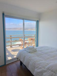 Postel nebo postele na pokoji v ubytování Bahía Luz Hostal