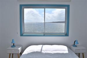 Postel nebo postele na pokoji v ubytování Bahía Luz Hostal