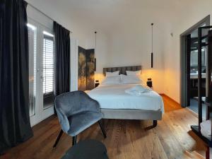 Postel nebo postele na pokoji v ubytování Gioiamia - Luxury Rooms in Cattedrale