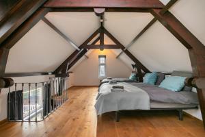 Postel nebo postele na pokoji v ubytování Edam Suites