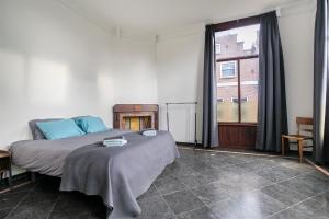 Postel nebo postele na pokoji v ubytování Edam Suites