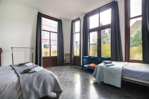 Postel nebo postele na pokoji v ubytování Edam Suites