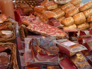 a display of different types of bread and pastries at Pensión Isabel by Vivere Stays in Salamanca