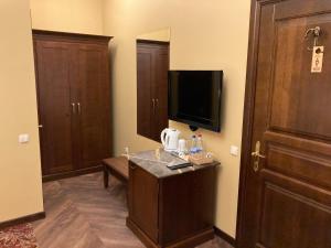 TV a/nebo společenská místnost v ubytování Guest House Pirklių Namai