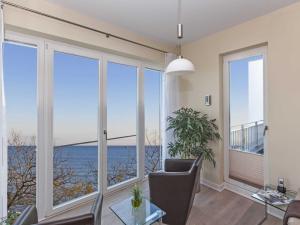 a living room with a view of the ocean at Ostseeresidenz Sassnitz F548 WG 16 mit Kamin, Sauna, Meerblick in Sassnitz