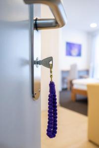Postel nebo postele na pokoji v ubytování Hotel Ochsen Rapperswil/BE
