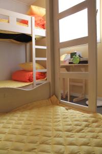 A bunk bed or bunk beds in a room at Egg House Namisum Guesthouse