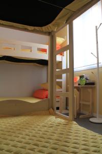 A bunk bed or bunk beds in a room at Egg House Namisum Guesthouse