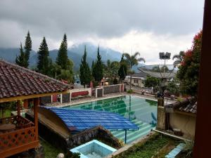 a view of a swimming pool in a building at Bungalow kampoengstrawberry ciwidey in Ciwidey