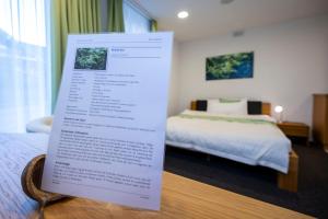 Postel nebo postele na pokoji v ubytování Hotel Ochsen Rapperswil/BE