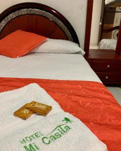 Postel nebo postele na pokoji v ubytování Hotel Mi Casita Pereira