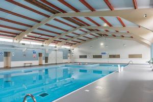 a large swimming pool with a large swimming pool at Kingsdown Chalet No.5 in Kingsdown