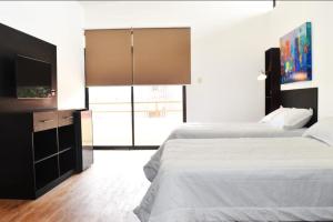Postel nebo postele na pokoji v ubytování Casa Taller Ramirez