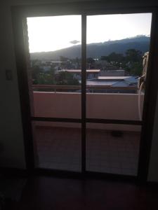 a room with a window with a view of a city at Departamento Centro in San Fernando del Valle de Catamarca