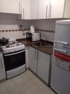 Kuchyň nebo kuchyňský kout v ubytování Departamento Centro