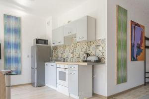 Η κουζίνα ή μικρή κουζίνα στο Apartament Artystyczny Zakątek +13 φωτογραφίες