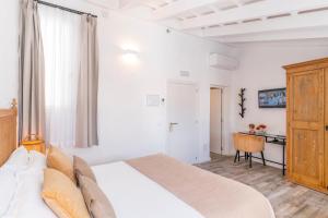 Postel nebo postele na pokoji v ubytování Encant de Alaior Boutique Hotel
