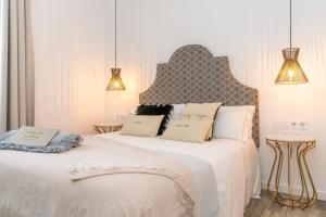 Postel nebo postele na pokoji v ubytování Encant de Alaior Boutique Hotel