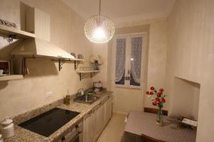 a kitchen with a sink and a counter top at Colosseum apartment in Rome