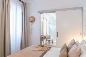 Postel nebo postele na pokoji v ubytování Encant de Alaior Boutique Hotel