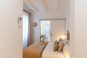 Postel nebo postele na pokoji v ubytování Encant de Alaior Boutique Hotel
