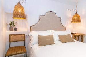 Postel nebo postele na pokoji v ubytování Encant de Alaior Boutique Hotel