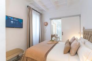 Postel nebo postele na pokoji v ubytování Encant de Alaior Boutique Hotel