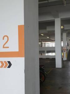 a parking lot with a number on a wall at SYG 4 Dwiputra Homestay Putrajaya 3 Bilik Tidur in Putrajaya