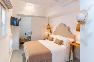 Postel nebo postele na pokoji v ubytování Encant de Alaior Boutique Hotel
