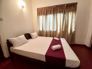 Cama ou camas em um quarto em Lazy Bear Best Hostel in Kandy