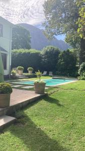 a house with a swimming pool in a yard at Park West Self-catering in Cape Town