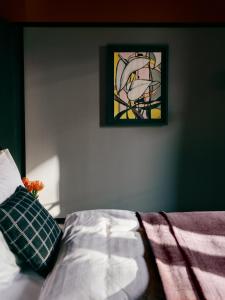 a bedroom with a bed and a stained glass window at WELTWIEN Luxury Art Apartments in Vienna