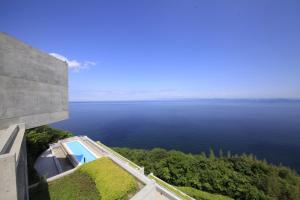 a view of the ocean from a house at TOTO Seawind Awaji in Awaji