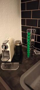 a kitchen counter with a toaster and a green glass at FeWo in Cranzahl in Cranzahl