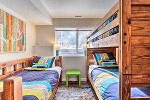 a bedroom with two beds and a window at Tasteful Mountain Getaway on Frisco Bike Path in Frisco