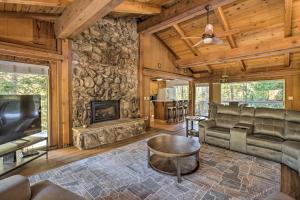 a living room with a couch and a fireplace at Tahoe City Home with Hot Tub - 1 Mi to Beach in Tahoe City