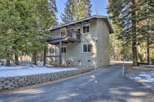 a house with a balcony on the side of it at Tahoe City Home with Hot Tub - 1 Mi to Beach in Tahoe City