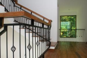 a staircase in a house with a window at Binnacle Negombo in Negombo